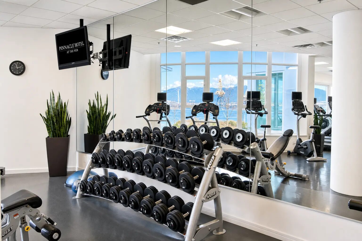 Fitness facility with terrace and Vancouver skyline view